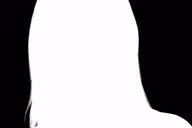 The alpha mask for the same frame: a solid white silhouette of her head and shoulders on black